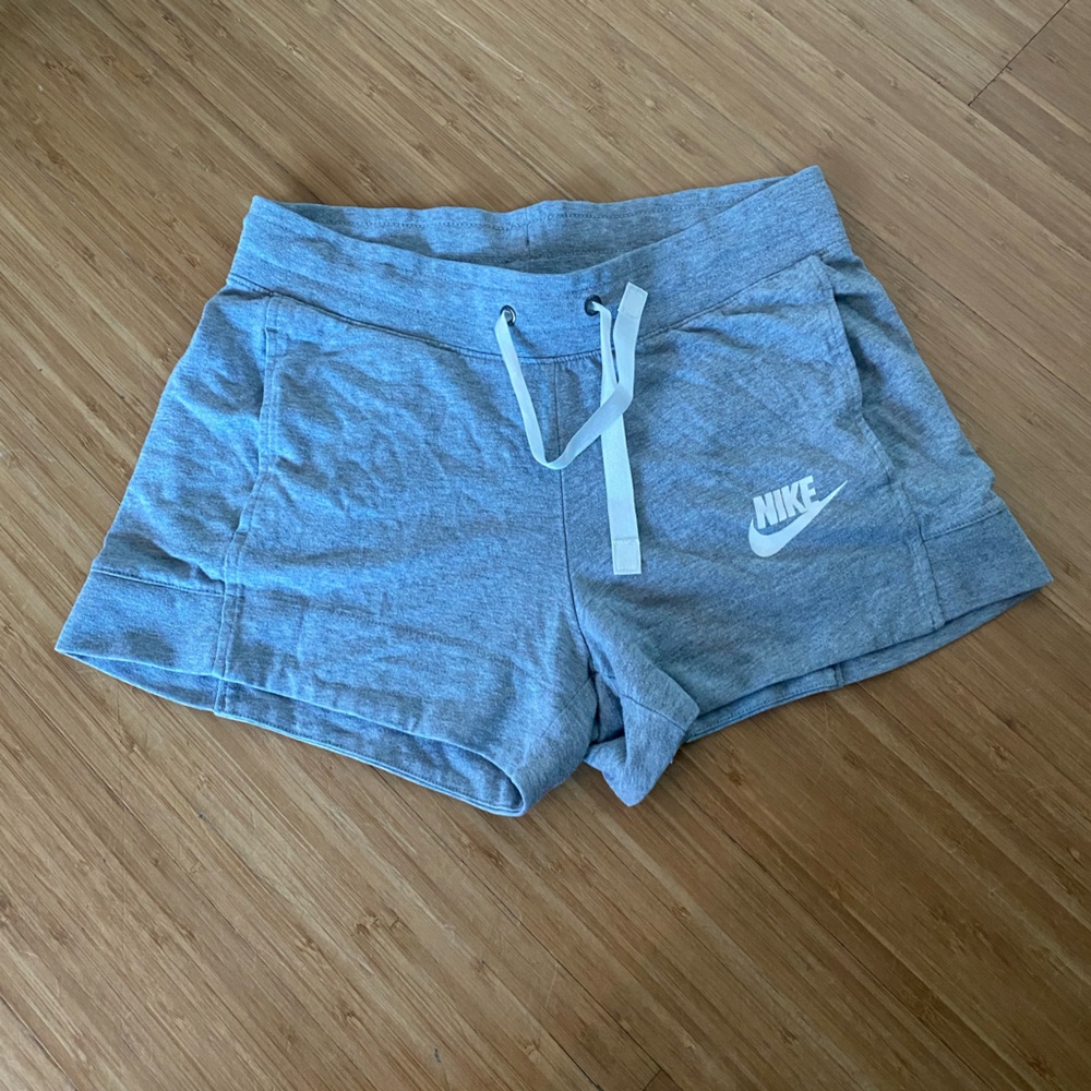Women’s Nike, grey, shorts with waist tie. Size small. In great condition.